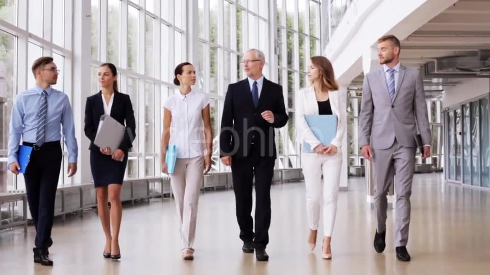 Business People Walking Along Office Building 7  Videohive 17383517 Stock Footage Image 2
