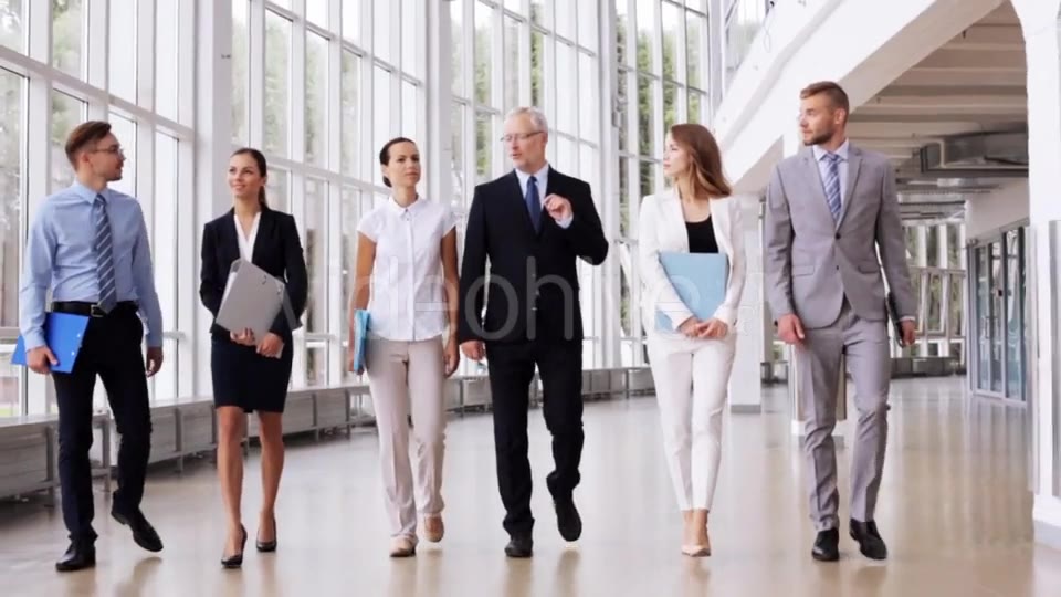 Business People Walking Along Office Building 7  Videohive 17383517 Stock Footage Image 3