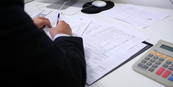 Businessman Filling Tax Forms  - Download 3334203 Videohive