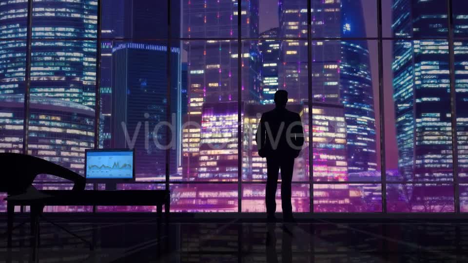 Businessman In An Office On A Background Of Night Skyscrapers Videohive 20445687 Motion Graphics Image 1