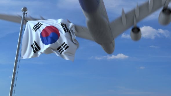 Commercial Airplane Landing Behind Waving Korean Flag - 20536803 Download Videohive