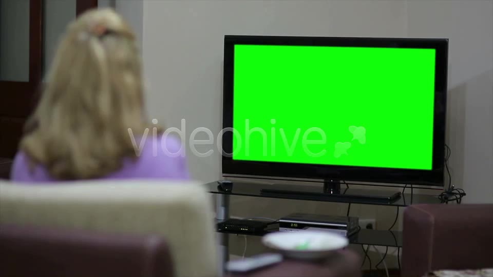 Couple Sitting In Front Of Blank Green TV Screen  Videohive 7794120 Stock Footage Image 2