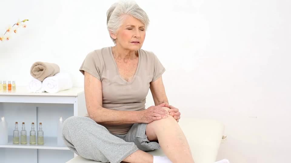 Injured Patient Rubbing Her Painful Knee  Videohive 8322587 Stock Footage Image 1