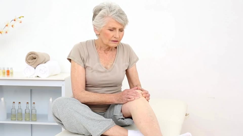 Injured Patient Rubbing Her Painful Knee  Videohive 8322587 Stock Footage Image 2