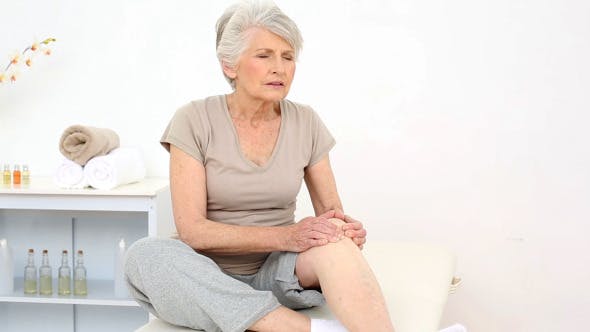 Injured Patient Rubbing Her Painful Knee  - Videohive Download 8322587