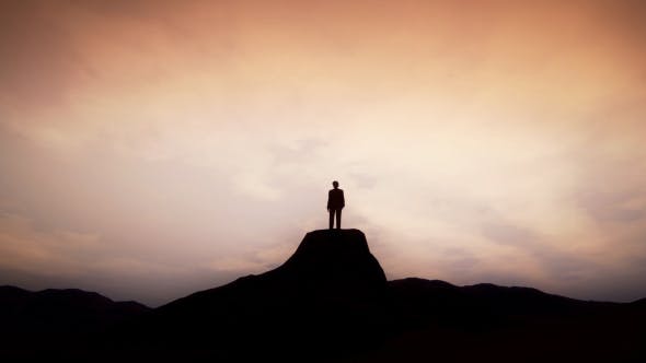 Man Standing on the Cliff of Mountain - 19432839 Download Videohive